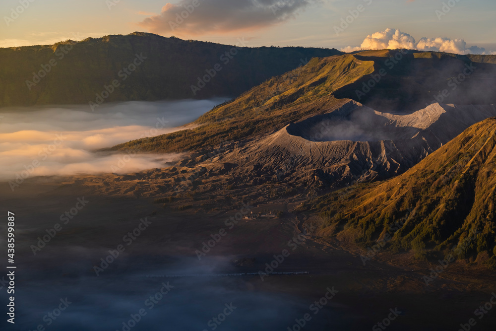 Mountain Bromo in the foggy morning. Mount Bromo is located in East Java, Indonesia. Mount bromo is a well known volcano together with mount batok and mount semeru.