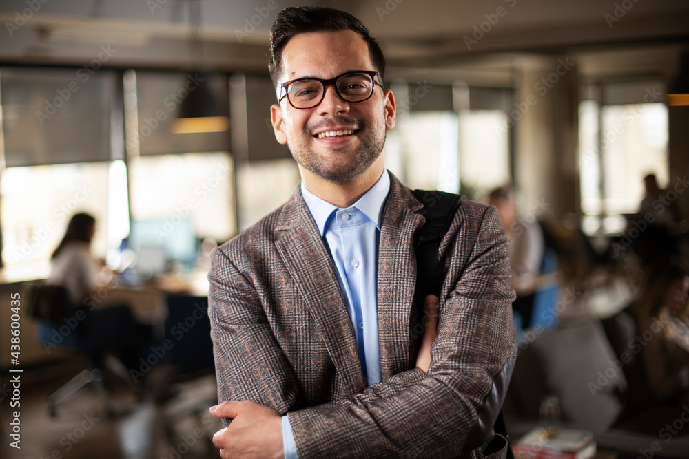 Fototapeta premium Portrait of handsome businessman. Young man working in the office.