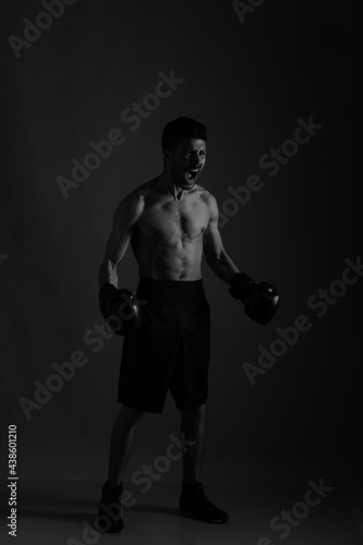 Black and white portrait of a boxer in shadows