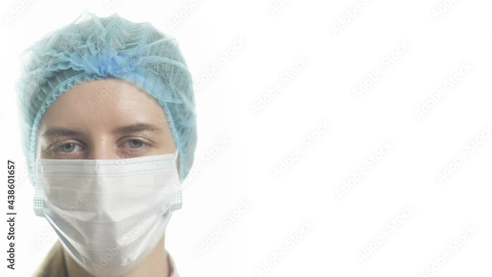 Portrait of a female doctor in medical uniform is looking at camera at hospital close up. Concept of health and treatment. Portrait of a female doctor in medical uniform is looking at camera at hospital close up. Concept of health and treatment.
