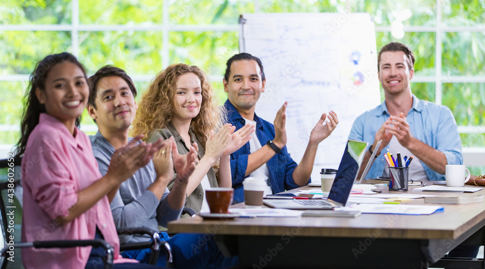 Banner multiracial diverse hipster casual working people team meeting, applauding with happiness and congratulation for successful creative projects and company while sitting in indoor modern office.