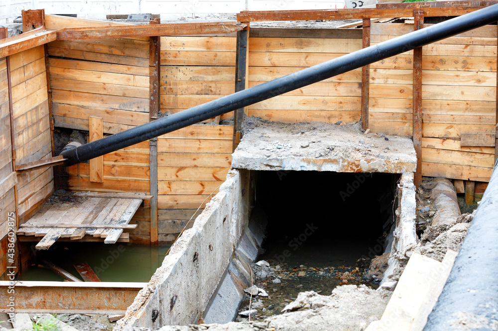 Repair of the destroyed city sewer in the daytime. Repair of the destroyed city sewer in the daytime.