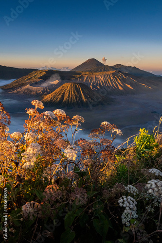 Mountain Bromo in the foggy morning. Mount Bromo is located in East Java, Indonesia. Mount bromo is a well known volcano together with mount batok and mount semeru. photo