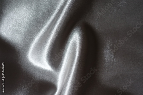 Rippled glossy gray unprinted polyester satin fabric