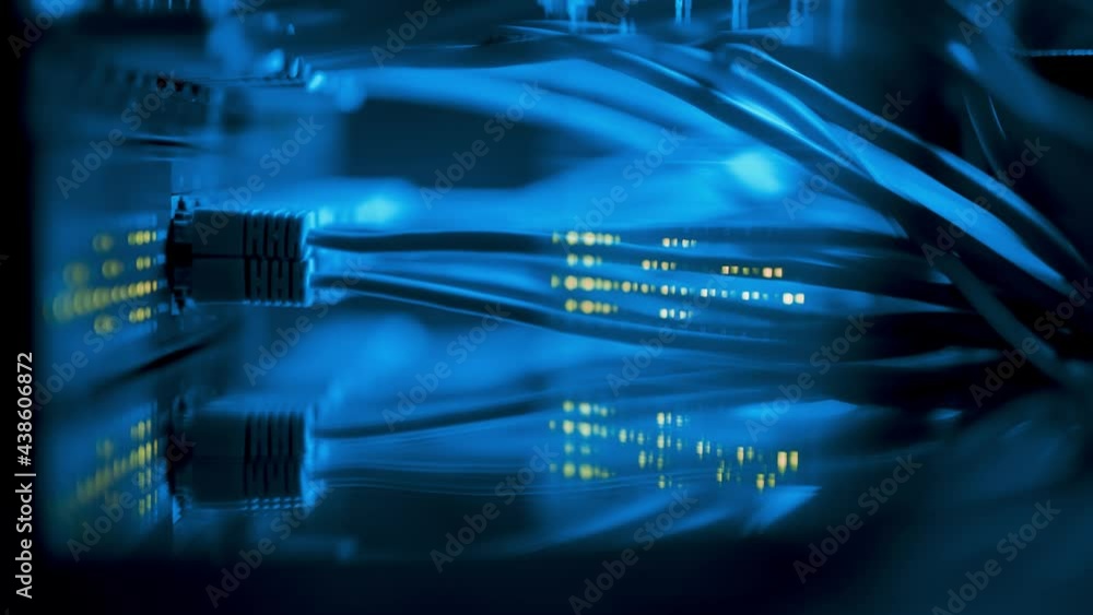 Super computer server racks in datacenter. Concept of big data storage and mining cryptocurrency. Network routers of ISP. Many wires connect to the network interfaces of powerful internet servers Super computer server racks in datacenter. Concept of big data storage and mining cryptocurrency. Network routers of ISP. Many wires connect to the network interfaces of powerful internet servers