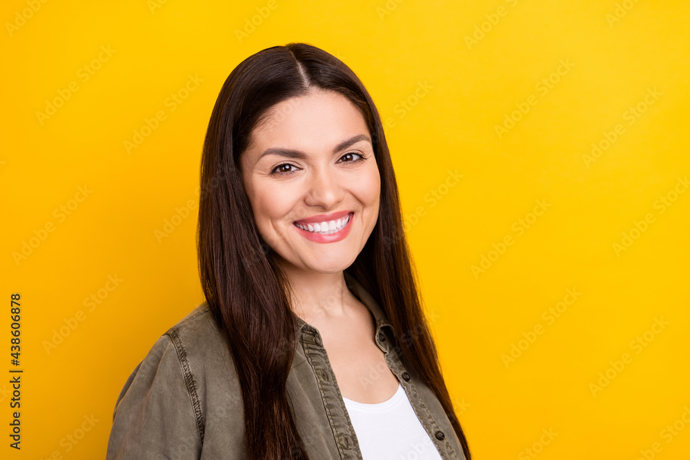 Photo of happy nice charming woman smile good mood wear casual clothes isolated on yellow color background Photo of happy nice charming woman smile good mood wear casual clothes isolated on yellow color background