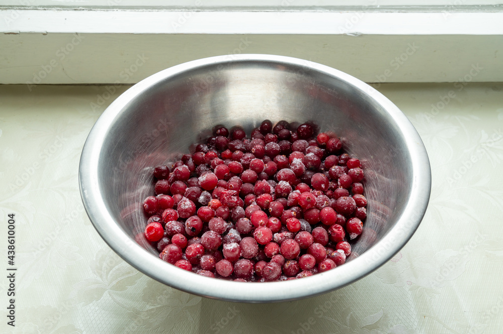 frozen cranberries in a metal bowl frozen cranberries in a metal bowl