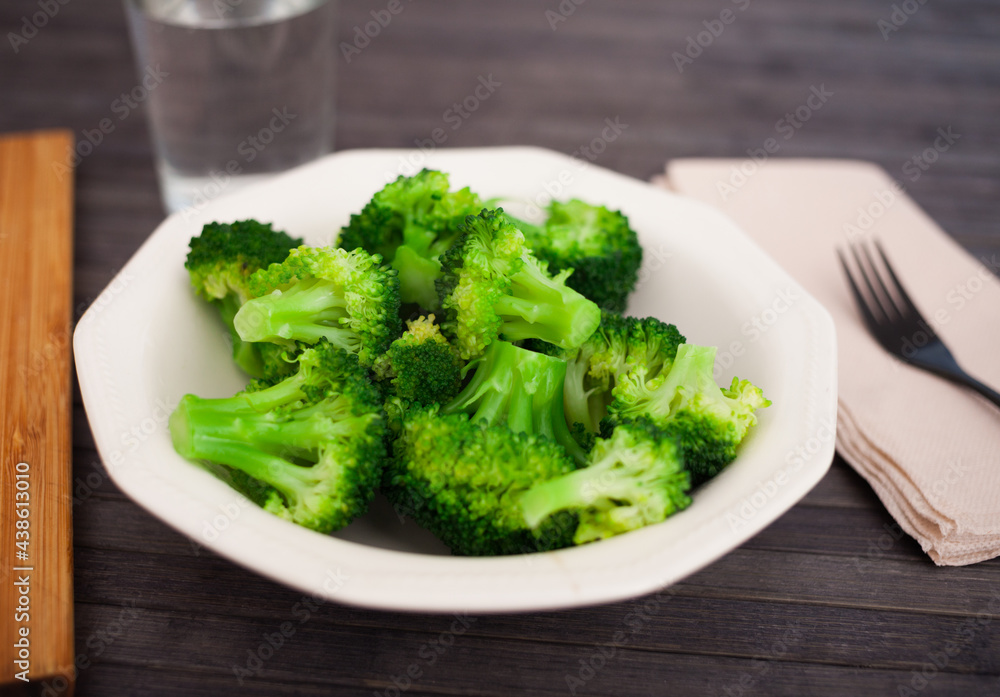 healthy food. steamed broccoli inflorescences in a bowl healthy food. steamed broccoli inflorescences in a bowl