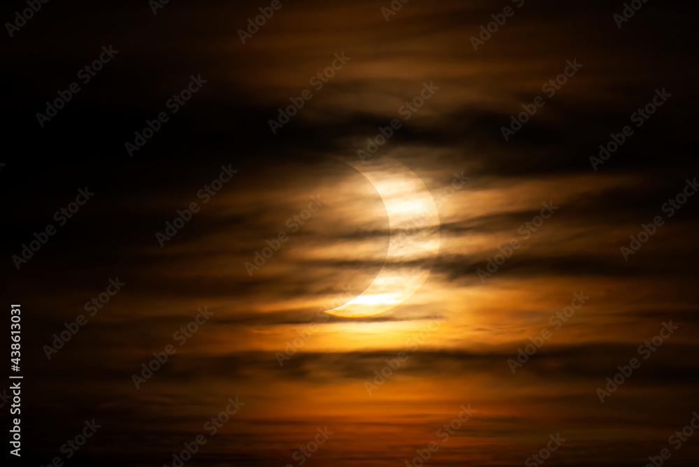 Annular Solar Eclipse through the morning clouds - June 10, 2021, Rural Kanata, Ontario, Canada