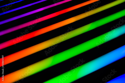 Φωτογραφία Neon rainbow strips on dark background