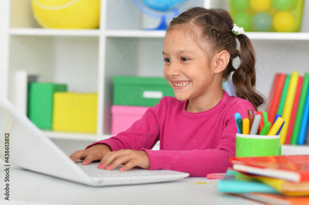 Porait of cute girl using laptop at home Porait of cute girl using laptop at home