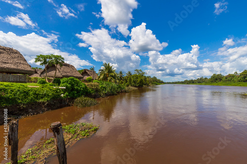 Palm Tree Roof Top Huts Along The Saramacca River In Groningen Suriname