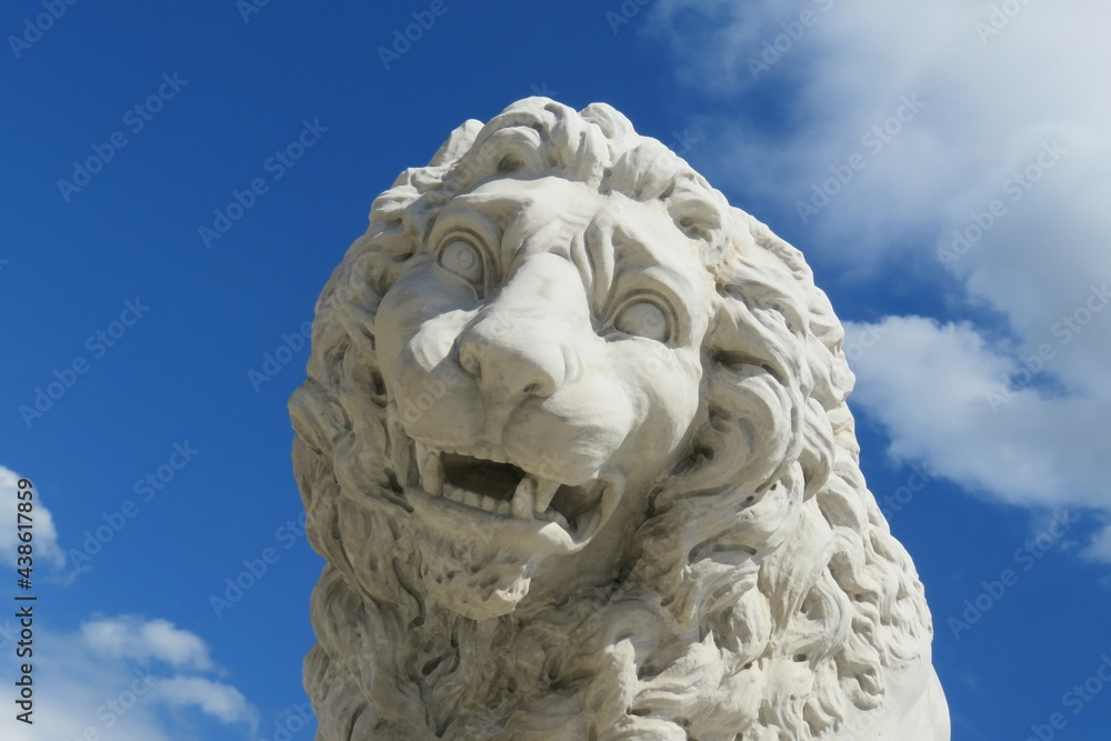Statue of a lion on blue sky background in St Augustine city in Florida