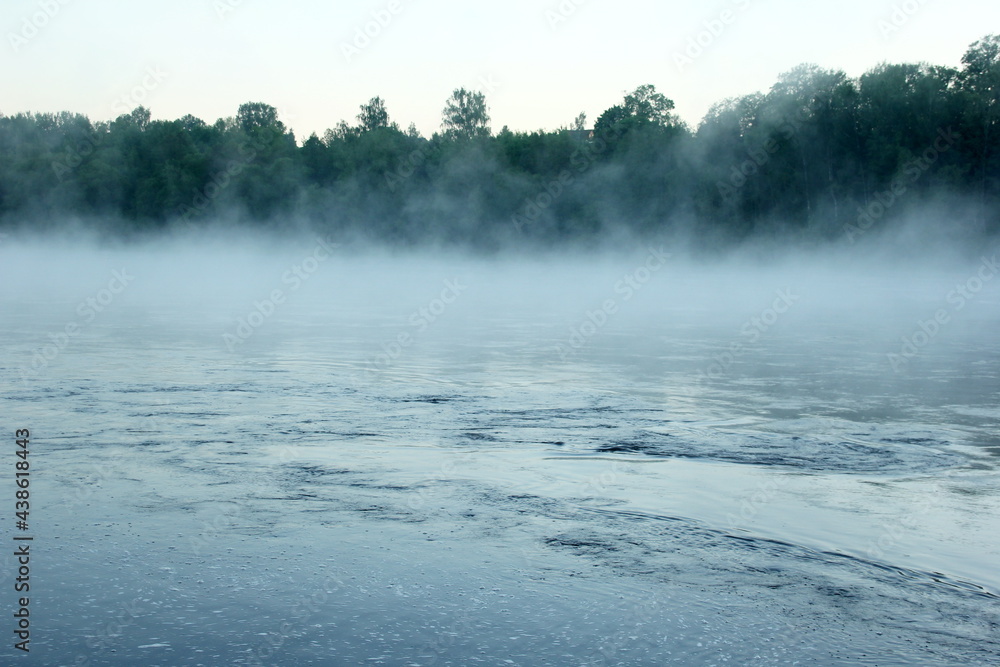 Fog on the river early in the morning during the summer