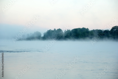 Fog on the river early in the morning during the summer