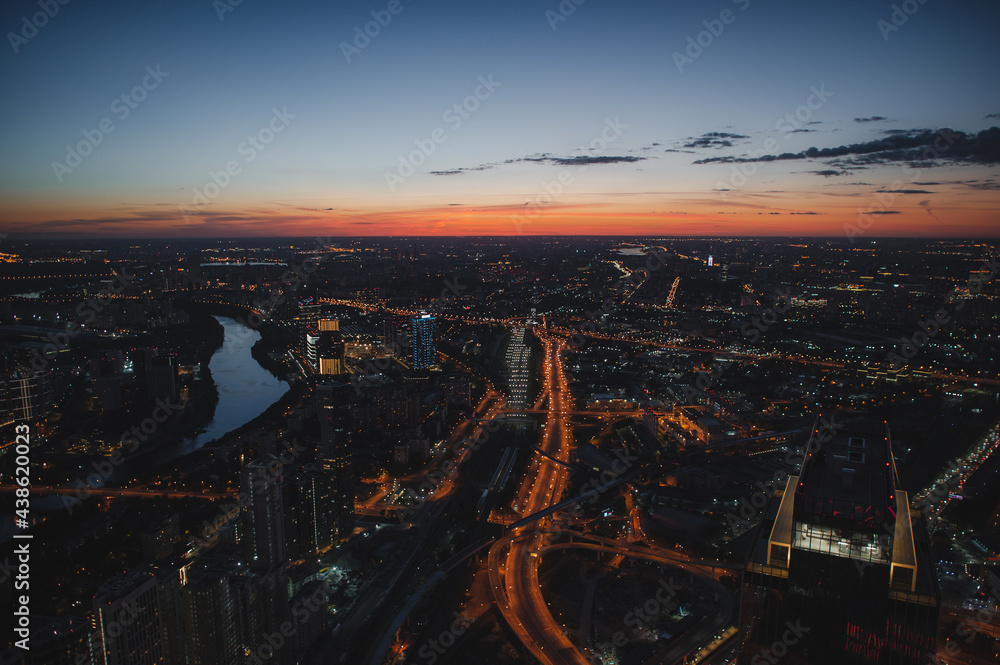 Night aerial view of the Moscow city traffic. View from the observation platform of the business center of Moscow City. Photography from a height of 354 meters.