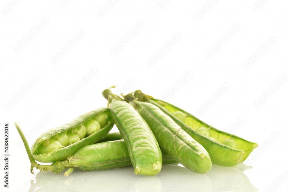 Several organic green pea pods, close-up, isolated on white. Several organic green pea pods, close-up, isolated on white.