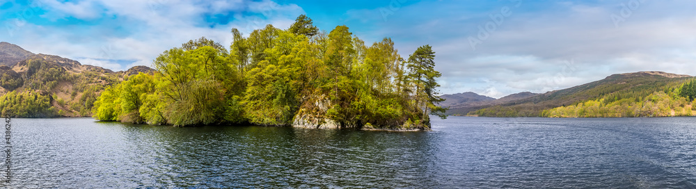 A view westward along Loch Katrine in the Scottish Highlands on a summers day A view westward along Loch Katrine in the Scottish Highlands on a summers day