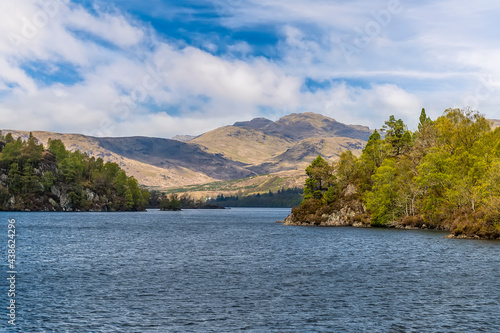 A view towards the western shore of Loch Katrine in the Scottish Highlands on a summers day photo