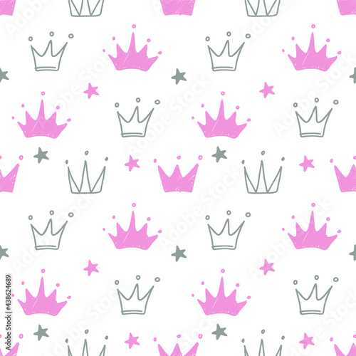 Hand drawn seamless pattern with doodle crowns. Cute baby and little princess design. Children's room wallpaper and clothes texture.