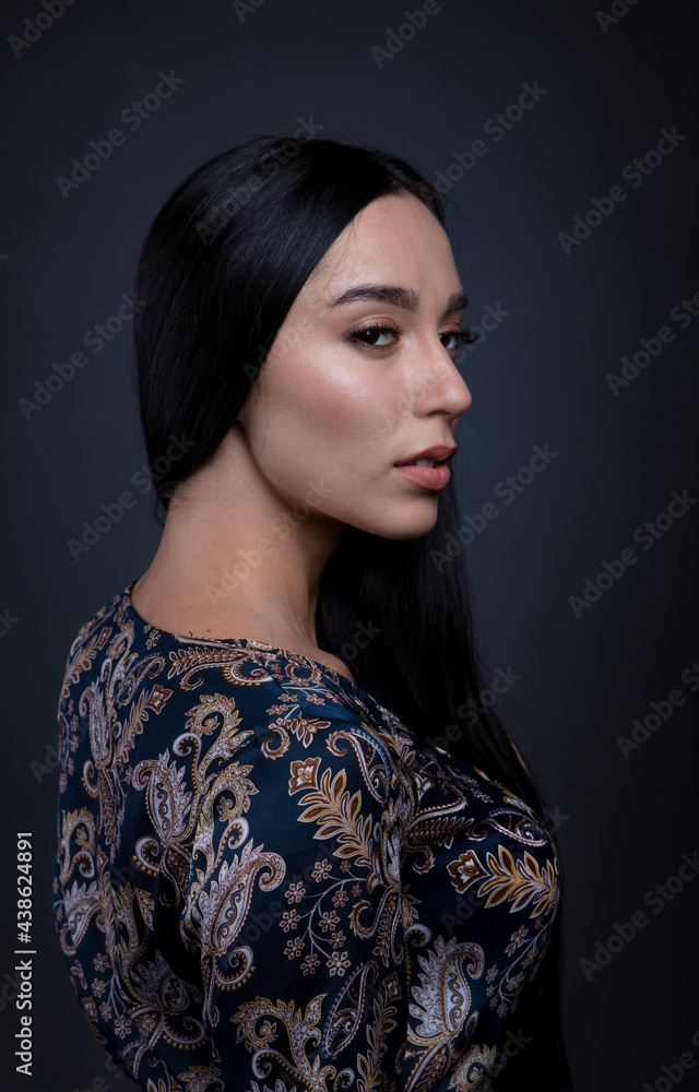 portrait of a young woman in the studio on a dark background portrait of a young woman in the studio on a dark background