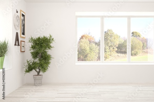 Stylish empty room in white color with autumn landscape in window. Scandinavian interior design. 3D illustration © AntonSh