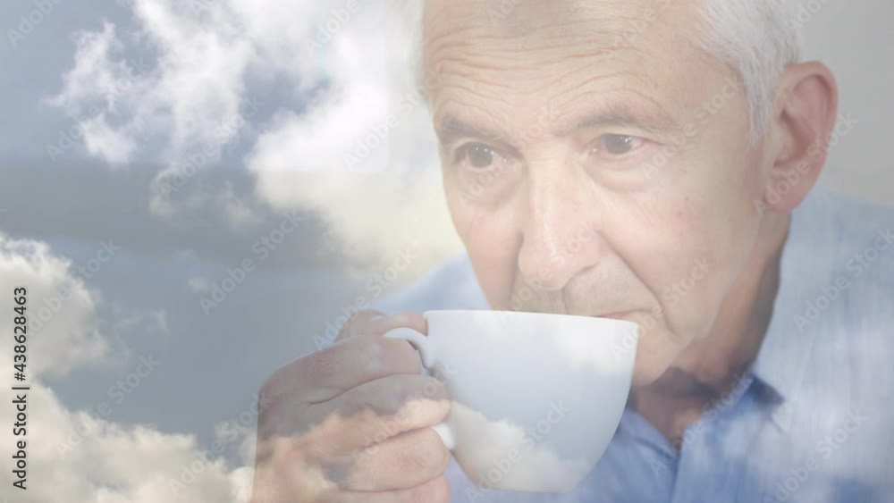 Animation of glowing light over pensive senior man drinking tea Animation of glowing light over pensive senior man drinking tea