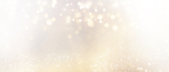 abstract glitter silver and gild lights background. de-focused