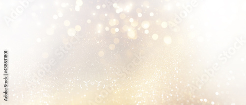 abstract glitter silver and gild lights background. de-focused