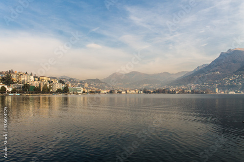 Landscape view of stunning sky and clouds above lake Lugano. Famous tourist destination in South Europe, Lugano, Switzerland