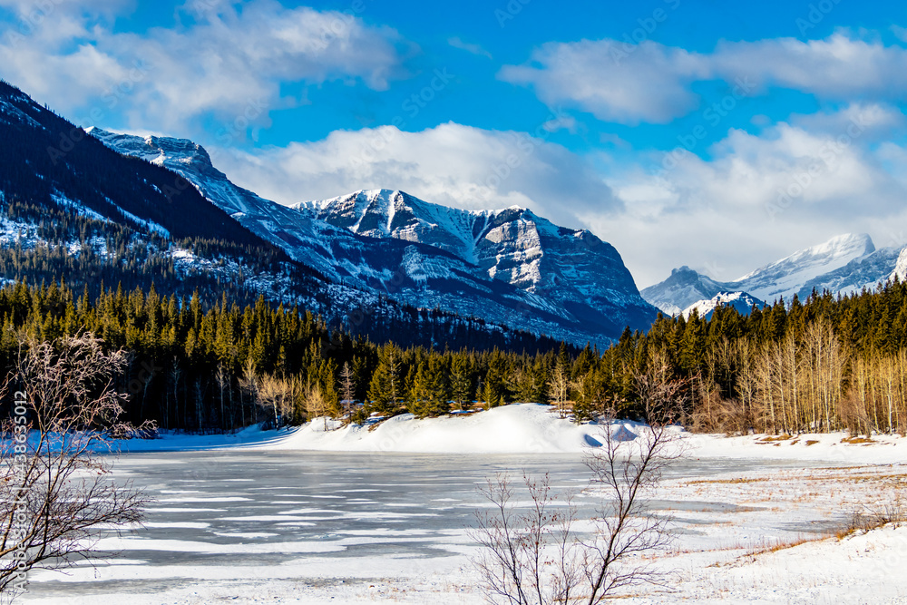 The Horton Range over an Ice covered Middle Lake, Bow Valley Provincial Park, Alberta, Canada