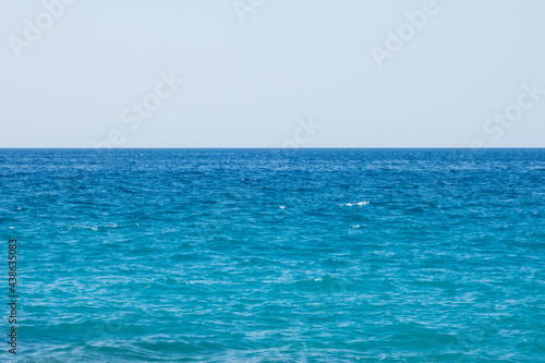 Bright blue sea on a windy and sunny day