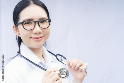 Female Doctor With Stethoscope On Isolated BackgroundFemale Doctor With Stethoscope photo