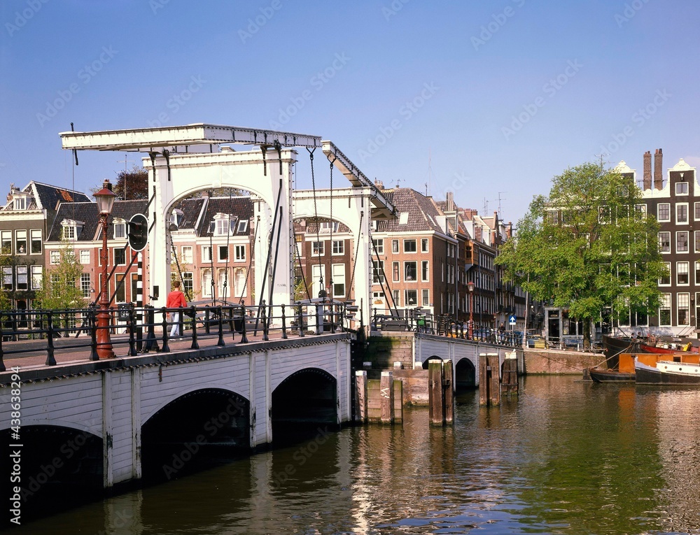 Naklejka premium Netherlands, Amsterdam, Amstel, Magere, Brug, Holland, North Holland, city, city view, capital, bridge, drawbridge, connection, architecture, houses, river, water, place of interest, orange route, 