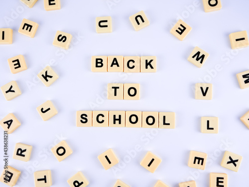 Square alphabets "BACK TO SCHOOL" isolated on a white background.