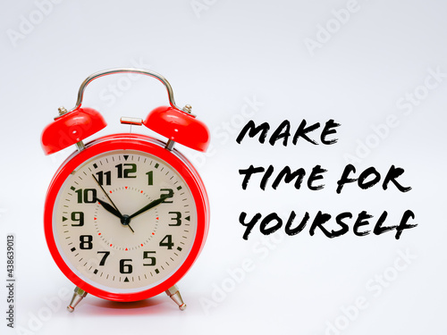 A red clock isolated on a white background with phrase "MAKE TIME FOR YOURSELF".