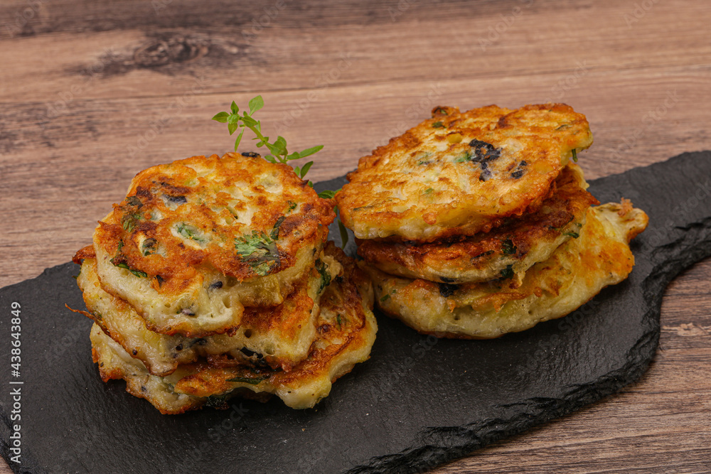Zucchini pancakes with herbs and spices Zucchini pancakes with herbs and spices