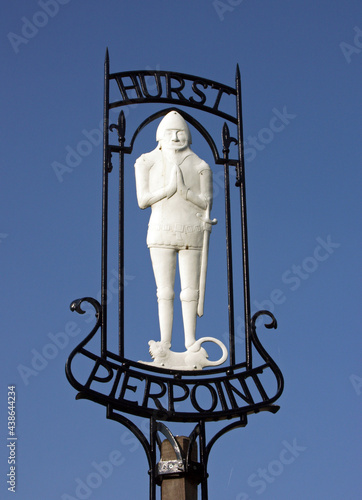 Village Sign showing a Historical Medieval Knight, Hurstpierpoint, West Sussex, England, UK photo