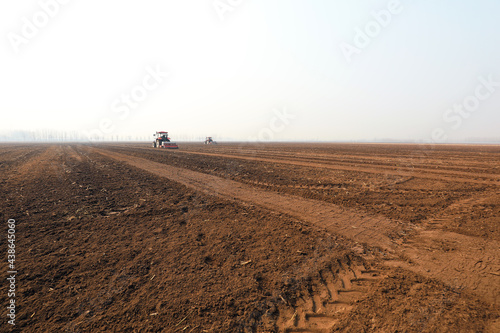 Farmers drive planters to grow peas on the farm