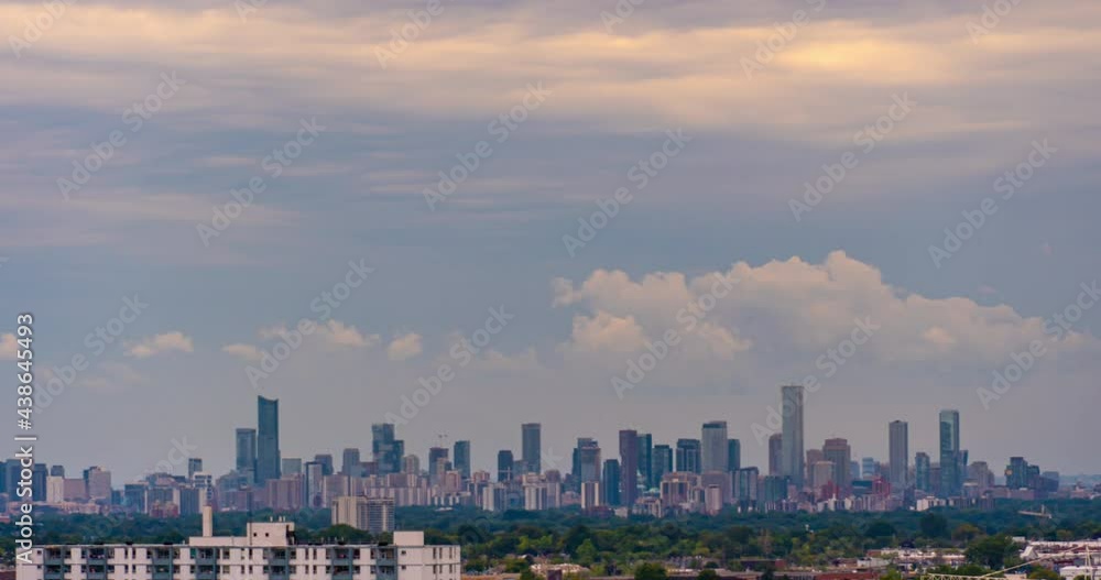 Timelapse of running clouds over American city downtown with feathered clouds in the sky. Toronto Canada autumn day. Cloudscape time lapse. 4k raw B-roll footage. Timelapse of running clouds over American city downtown with feathered clouds in the sky. Toronto Canada autumn day. Cloudscape time lapse. 4k raw B-roll footage.