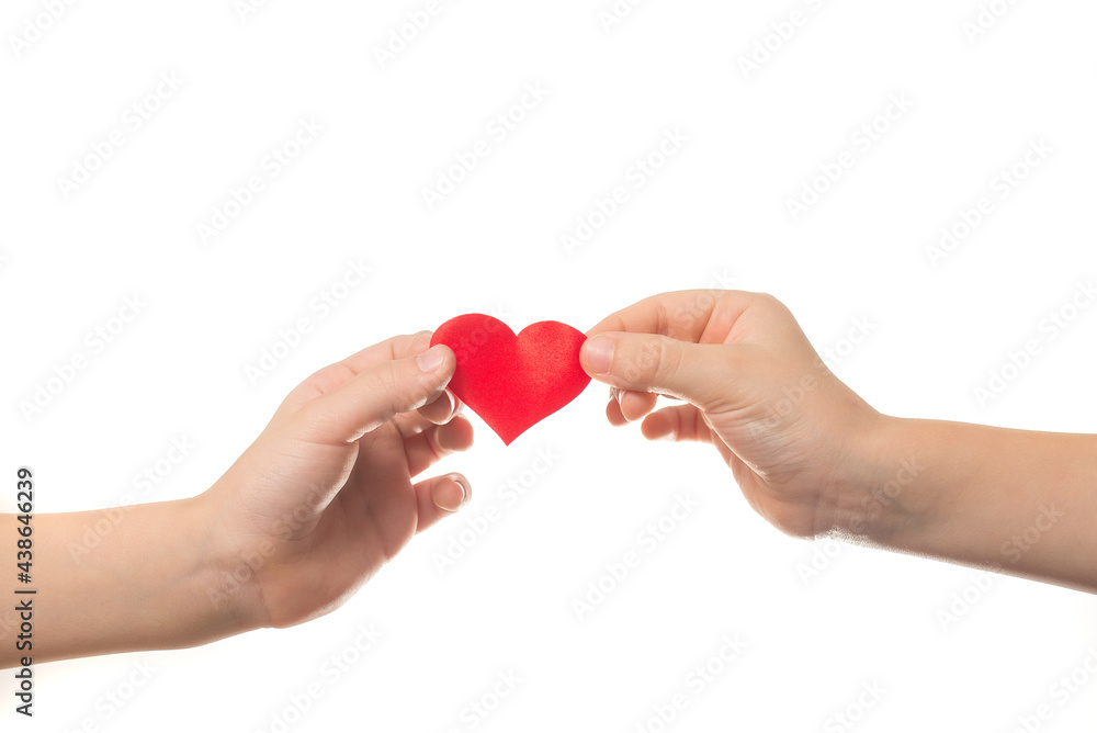 hand-to-hand transfer of a red heart hand-to-hand transfer of a red heart