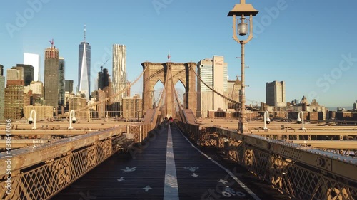 Brooklyn Bridge Promenade at sunrise with Manhattan skyline in the background - Steadicam shot