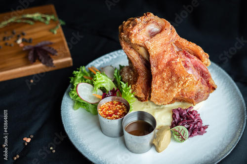 Photography Crispy German Pork Knuckle delicious juicy yummy with in Thai style served with seafood sauce