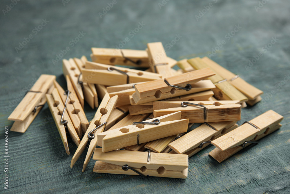 Pile of clothes pins on blue wooden table