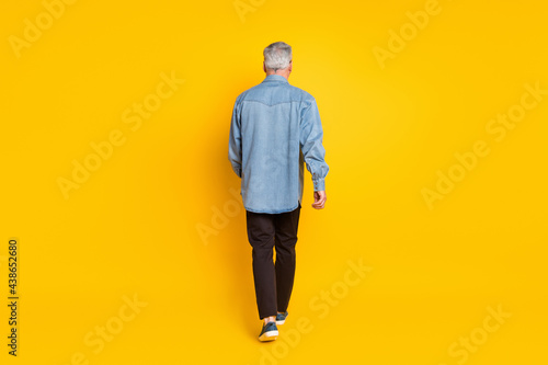 Full length back photo of trend grandpa go wear jacket pants shoes isolated on yellow color background