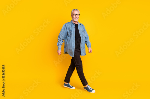 Full body profile photo of funny grandpa go wear eyewear jacket pants isolated on yellow background