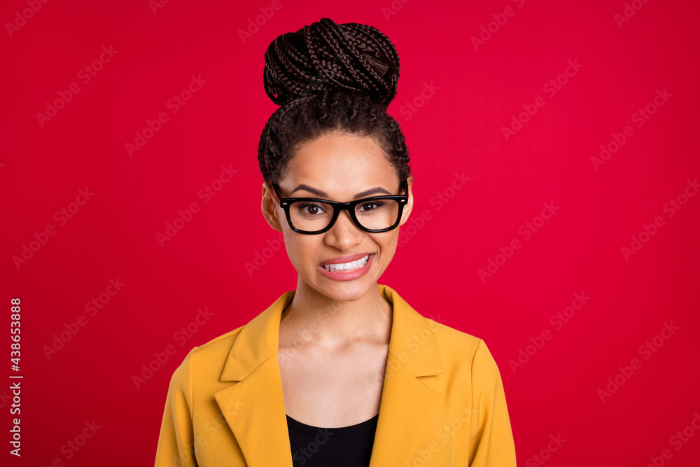 Photo of sad staring lady do not like wear eyewear yellow cardigan isolated on vivid red color background