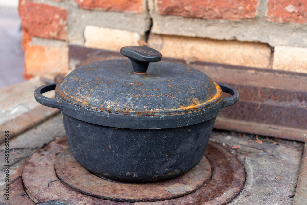 fire hearth of russian oven and old cast-iron pot fire hearth of russian oven and old cast-iron pot