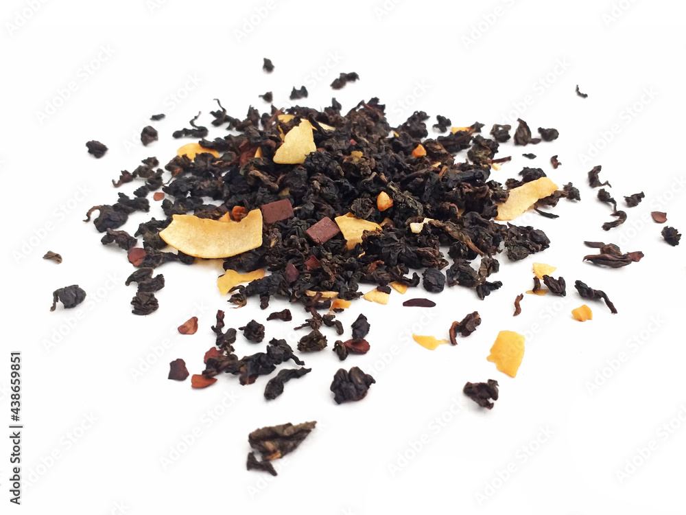 Aerial view of organic black tea with almond and coconut. Ground dried leaves or buds of the Camellia sinensis bush for flavored infusion. Drinks and infusions concept.