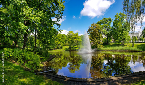 Panorama of the Riga canal against the background of beautiful Kronvalda Park on summer day in Riga, Latvia.